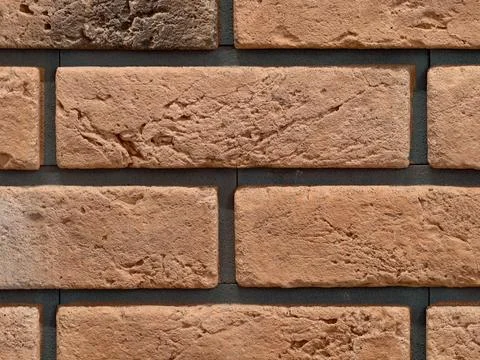Traditional brick facade, authentic handmade brick with earthy terracotta hues Stock Photos