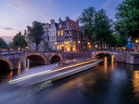 Traditional canal houses at dusk in Amsterdam Stock Photos