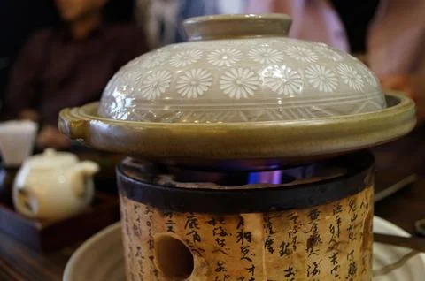 Traditional Ceramic Pot With Flower Pattern On Stove Stock Photos