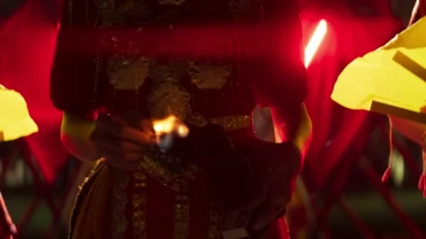 Traditional ceremony with fire torch and ornate costume Stock-Footage 345861024