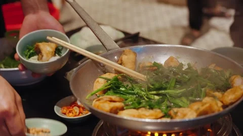 Traditional cha ca fish dish prepared at Cha Ca Thang Long, Hanoi Stock Footage 330049794