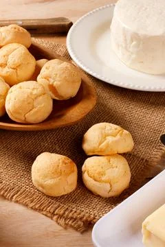 Traditional cheese bread served with white cheese and butter on a jute clot.. Stock Photos