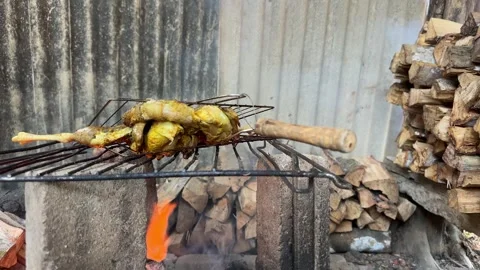 Traditional Chicken Grilling Over Fire pit With Smoke Stock Footage 327993773