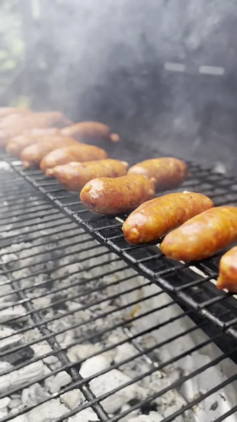 Traditional Chile barbecue featuring sizzling sausages hot Stock Footage 342335183