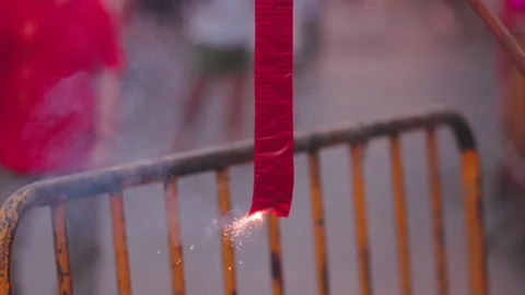 Traditional chinese firecrackers are exploding with flashes and smoke in Lu.. Stock Footage 327544393