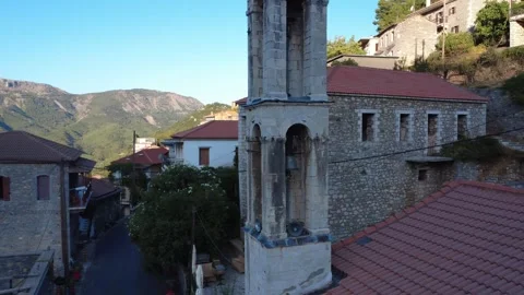 Traditional Christian Bell Tower against Mountain Horizon Stock Footage 326352853