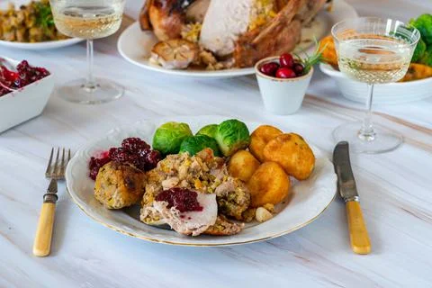 Traditional Christmas dinner with roasted turkey, apricot and pistachio stuff Stock Photos