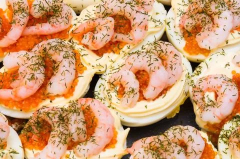 Traditional christmas easter dish egg halves with shrimp and mayonaise and ca Foto stock