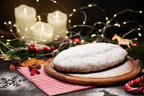 Traditional Christmass stollen cake with marzipan and dried fruit on rustic Stock Photos