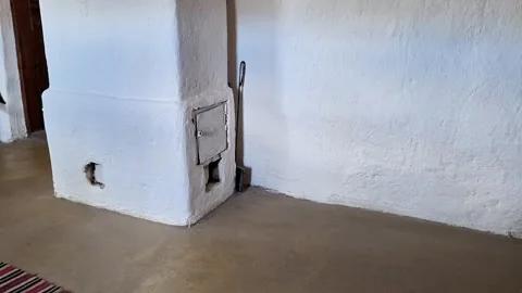 Traditional Clay Stove Built Into Whitewashed Village Home 動画素材 335861788