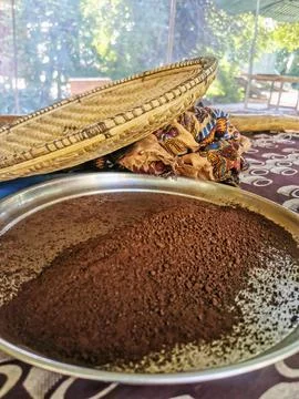 Traditional Coffee Drying Process with Ground Coffee and Woven Basket Display Stock Photos