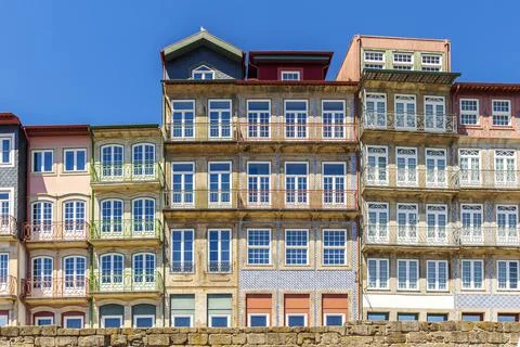 Traditional colorful houses on the historic embankment of Porto, Portugal Stock Photos