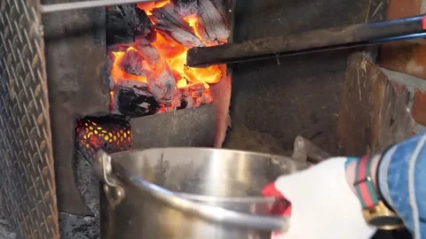 Traditional Cooking Process of Sizzling Steak on Charcoal Stove with Open Fire a Stock Footage 338210774