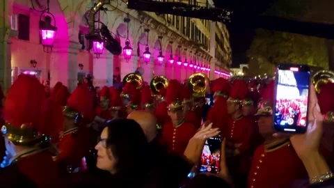 Traditional Corfu Philharmonic Band Procession in Red Uniforms, Night Parade Stock Footage 334786822