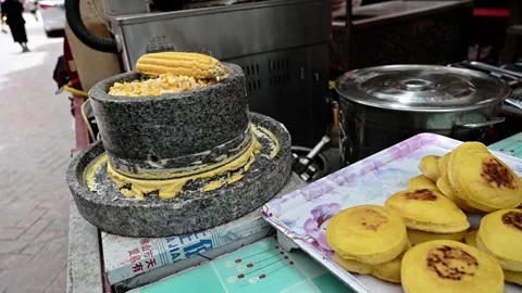 Traditional Corn Cakes Made from Stone Ground Corn in Kashgar Stock Footage 343488555
