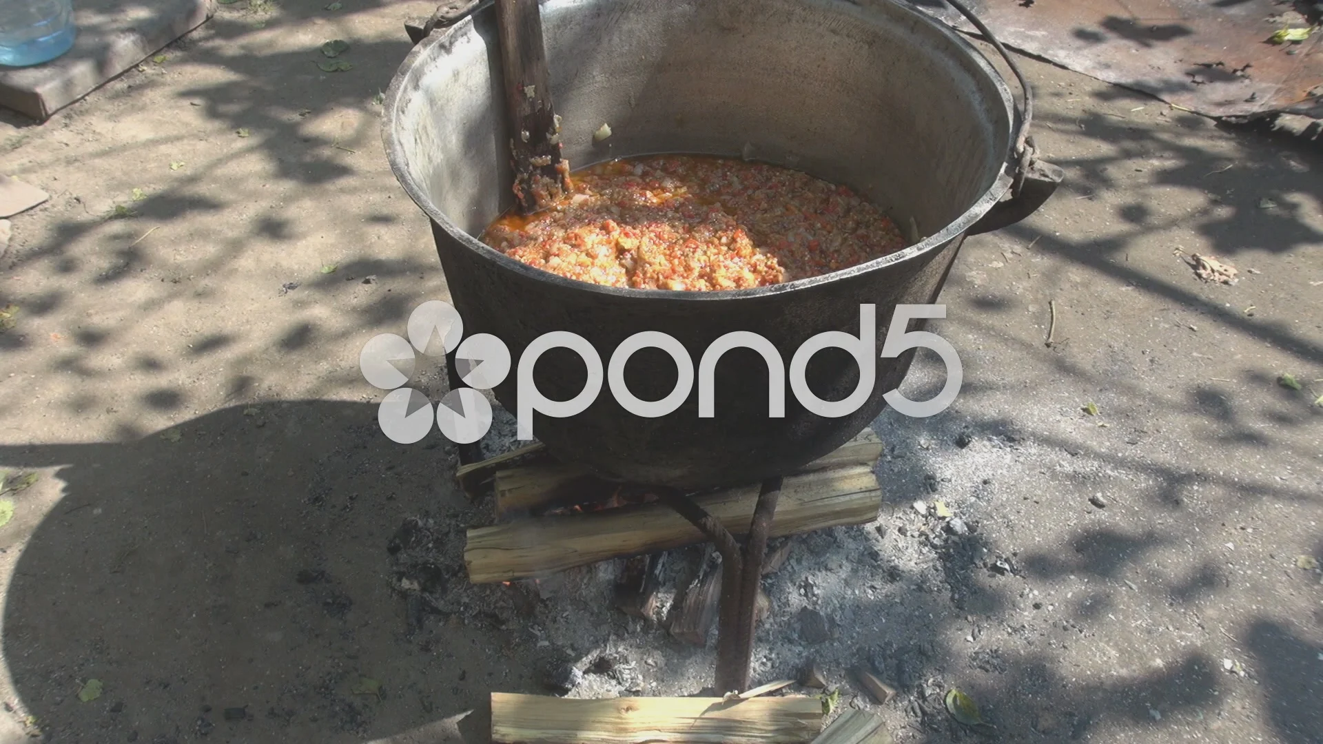Traditional Cuisine Big Black Pot Cooking Food, Natural Fire With