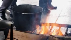 Traditional Cuisine Big Black Pot Cooking Food, Natural Fire With