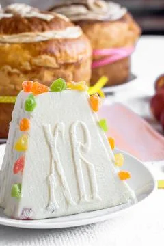 Traditional curd Easter cake with candied fruits on light table Stock Photos