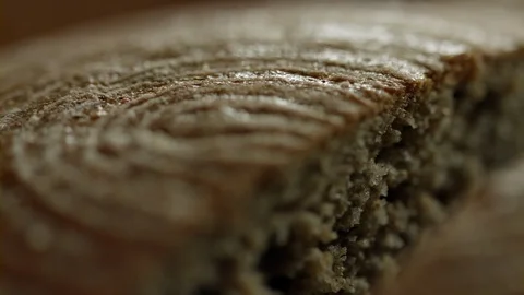 Traditional cut bread loaf macro Video stock 93102403