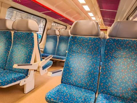 Traditional Czech double-decker train,view from inside on empty upholstered seat Stock Photos