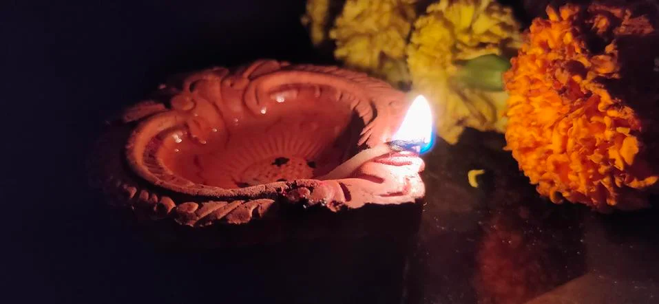Traditional diyas lamp lit up during the Diwali - Festival of Lights Stock Photos