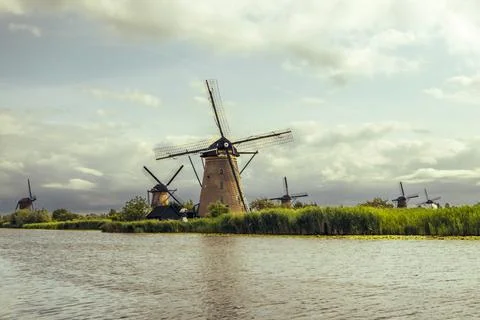 Traditional drainage windmills under a dramatic sky in Kinderdijk Stock Photos