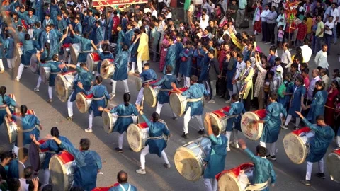 Traditional drum performance on streets during Ganesh Chaturthi festival Stock Footage 305244692