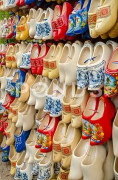 Traditional dutch clogs wooden shoes in souvenir store amsterdam Stock Photos