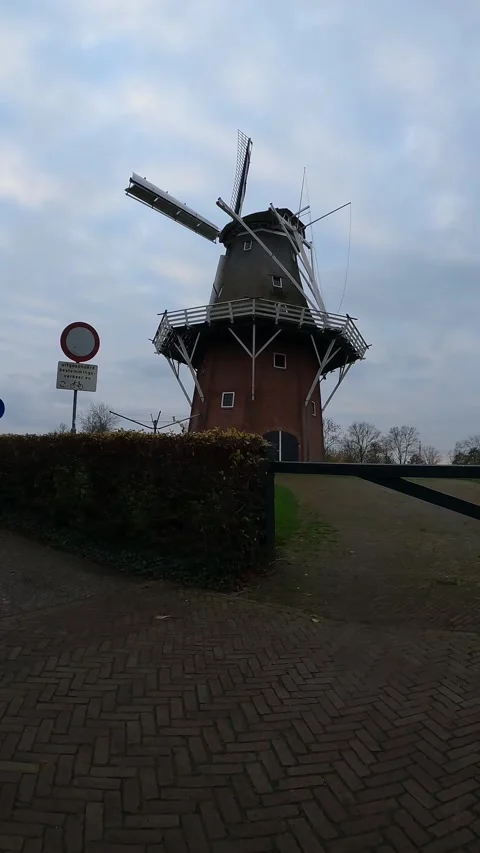 Traditional Dutch windmill with brick base in the Netherlands. Stock-Footage 343014290