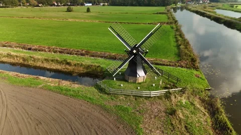 Traditional Dutch Windmill Surrounded by Fields – 4K Aerial, Netherlands Video stock 318238648
