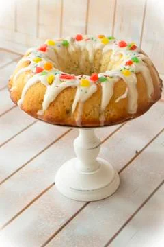 Traditional easter babka cake on kitchen table, vertical vintage image Stock Photos