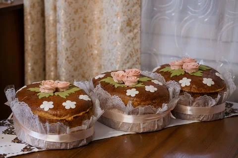 Traditional Easter Bread Decorated with Pink Roses and White Flowers on Lac.. Stock Photos