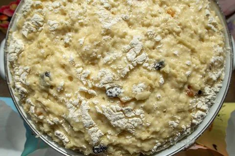 Traditional Easter Bread Dough Rising in Bowl with Paper Baking Molds Around Stock Photos