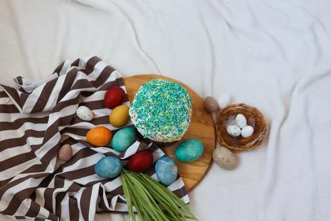 Traditional Easter cake and painted eggs on white background. Space for text Stock Photos