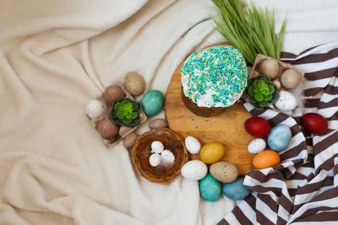Traditional Easter cake and painted eggs on white background. Space for text Stock Photos