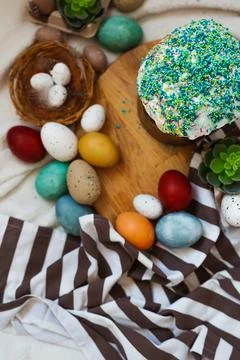 Traditional Easter cake and painted eggs on white background. Stock Photos
