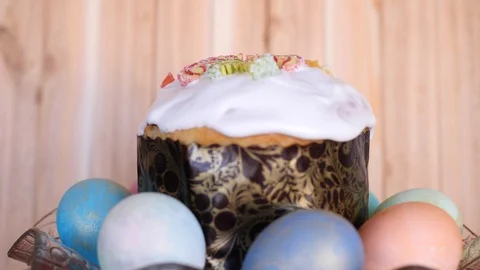 A traditional Easter cake decorated with glaze and candied fruits with colored Stock Footage 106044983
