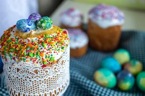 Traditional Easter cake with glace icing and painted easter eggs.Rustic style Stock Photos
