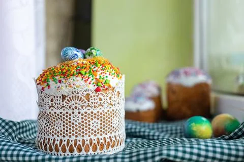 Traditional Easter cake with glace icing and painted easter eggs.Rustic style Stock Photos