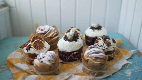 Traditional Easter cakes creatively decorated with white icing, candied fruits Stock Footage 234809149