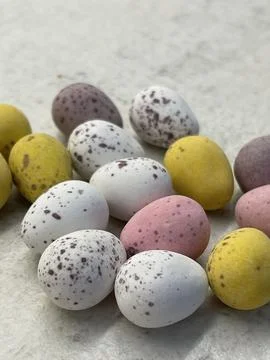 Traditional easter chocolate eggs on white table Stock Photos