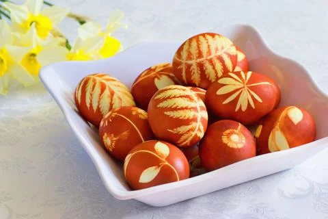 Traditional Easter eggs dyed with natural onion peels and leaves or flowers. Фото