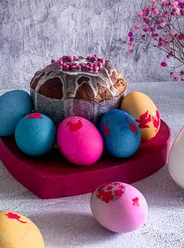 Traditional Easter food of Orthodox Easter cake and colored painted eggs, ver Stock Photos