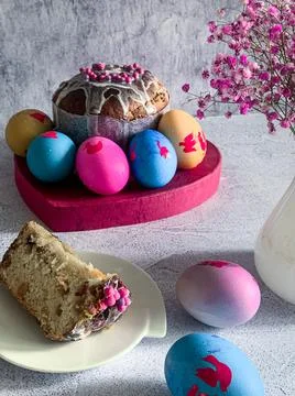 Traditional Easter food of Orthodox Easter cake and colored painted eggs, a p Stock Photos