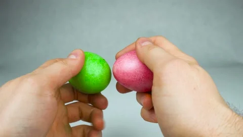 Traditional Easter game Egg tapping or dumping competition with coloured eggs Video stock 104506676