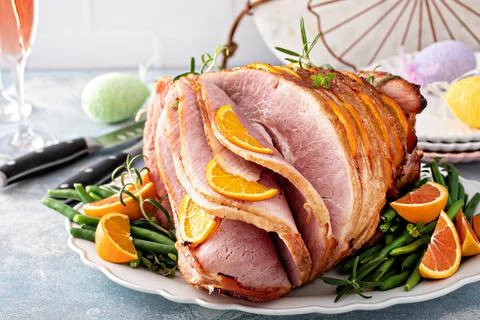 Traditional Easter ham with orange honey glaze Stock Photos