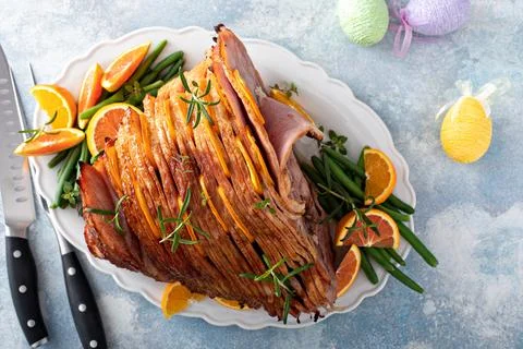 Traditional Easter ham with orange honey glaze Stock Photos