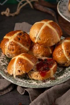 Traditional Easter Hot Cross Buns Stacked on Vintage Plate with Jam and Sul.. Stock Photos