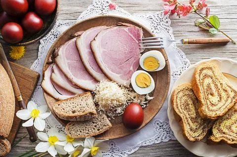 Traditional Easter meal with ham, eggs and bread Stock Photos