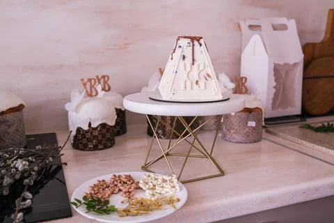 Traditional Easter paskha cake on white stand with Orthodox christian kulich Stock Photos